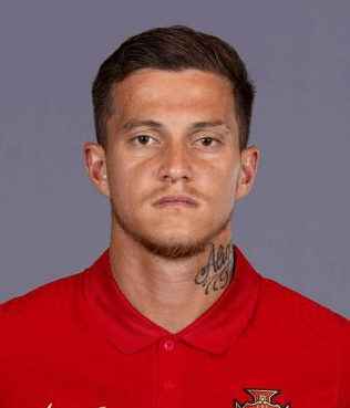 Foto de rosto de Otávio com a camisola da seleção nacional